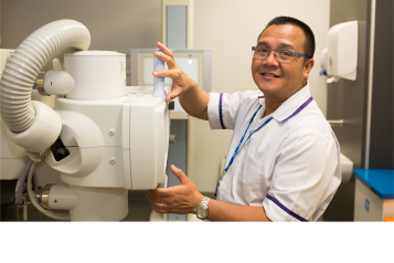 man infront of hospital equipment