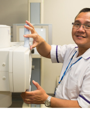 man infront of hospital equipment